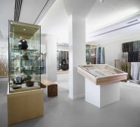 Display cabinets in a white painted gallery