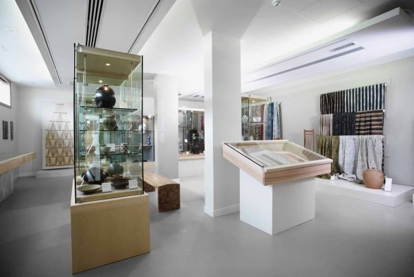 Display cabinets in a white painted gallery