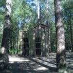 Wooden structure in a wooded area.