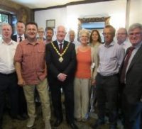 Mayor with group of business people