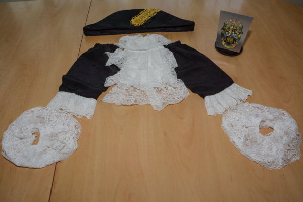 Mayoral robes and crest laid out on the table