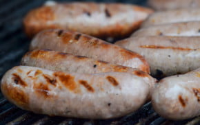 Sausages cooking.