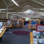 Inside of a library with books on display and on shelves