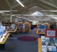 Inside of a library with books on display and on shelves