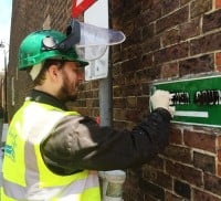 Man removing graffiti