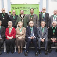 10 males and 2 females sitting after receiving awards.