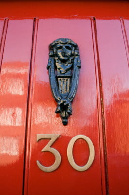 Red front door, door knocker, no 30.