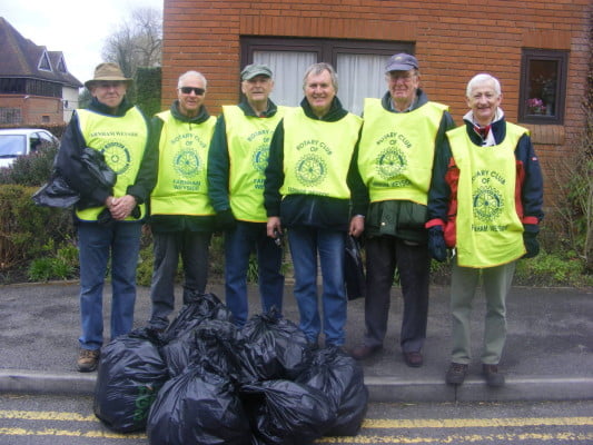 Group of males with high vis vests.