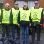 Group of males with high vis vests.