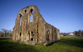 Stone ruins with grass surroundings.