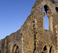 Ruins of a former abbey. Blue sky