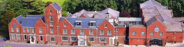 Aerial view of a large red brick building