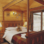 Four poster bed, wooden interior