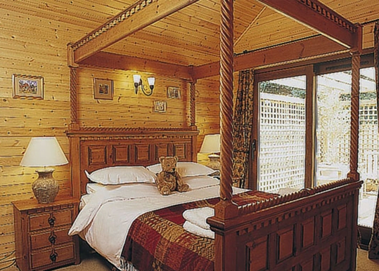 Four poster bed, wooden interior