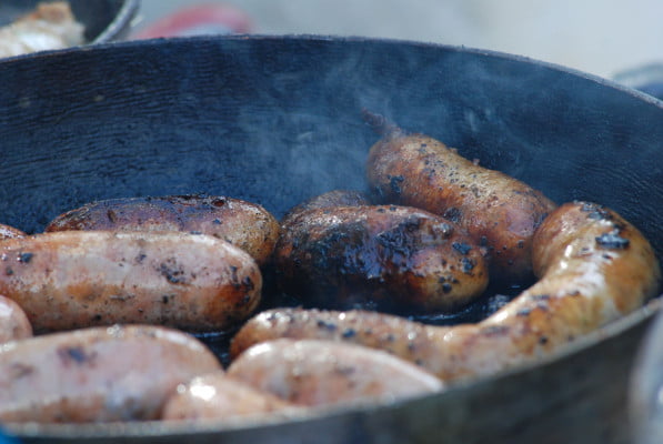 Cooking sausages. Frying pan.