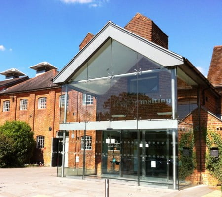 brick building with glass front and doors.