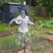 Scarecrow, plant pot hat, silver jumper, CD skirt, Lady Gaga