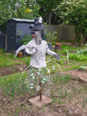 Scarecrow, plant pot hat, silver jumper, CD skirt, Lady Gaga