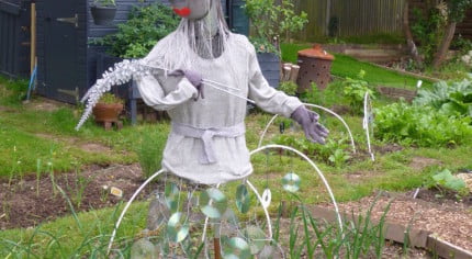 Scarecrow, plant pot hat, silver jumper, CD skirt, Lady Gaga