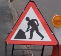 Triangular shaped roadworks sign.