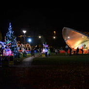 Park at night, with a stage, christmas lights and christmas tree