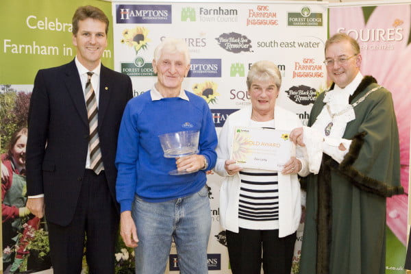 Male and female receive award from Mayor