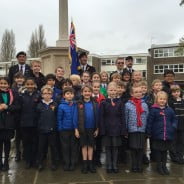 School children, standard bearer, war memorial, Armistice Day 2014.