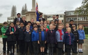 School children, standard bearer, war memorial, Armistice Day 2014.