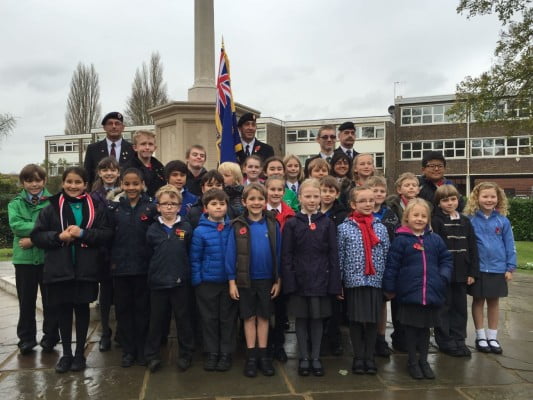 School children, standard bearer, war memorial, Armistice Day 2014.