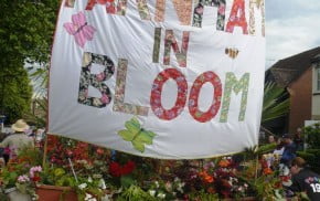 Trailer, Farnham in Bloom banner, flowers on trailer. Carnival float.