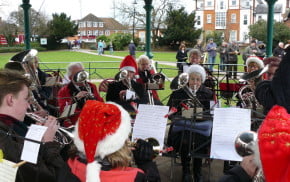 The Farnham Brass Band playing in the bandstand in Gostrey Meadow.