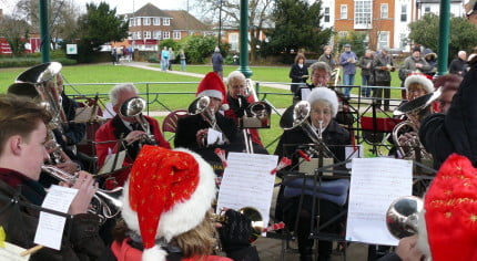 The Farnham Brass Band playing in the bandstand in Gostrey Meadow.