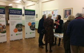 People talking and looking at exhibition.