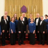 Eleven male and female choir members in smart dress.