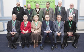 10 males and 2 females sitting after receiving awards.