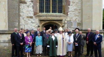 group of people outside church.