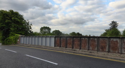 Railway bridge, partly painted.