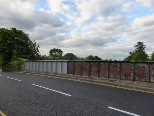 Railway bridge, partly painted.