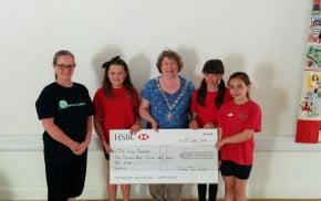 The Mayor presents a cheque to young dancers.