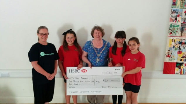 The Mayor presents a cheque to young dancers.