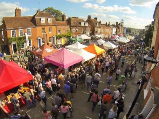 Aerial view of a crowded street market.