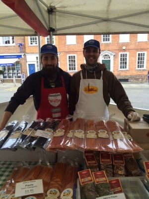 2 males selling pasta.