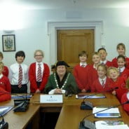 Children with the Mayor in the council chamber