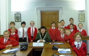 Children with the Mayor in the council chamber