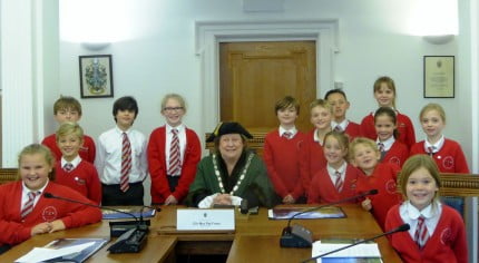 Children with the Mayor in the council chamber