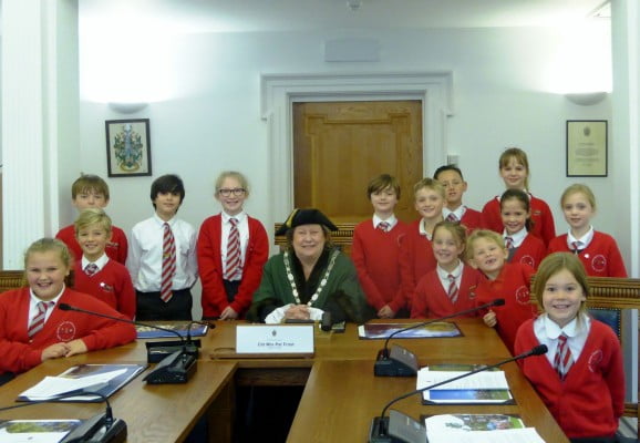 Children with the Mayor in the council chamber