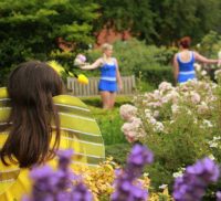 Young people dancing in a garden