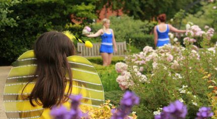 Young people dancing in a garden