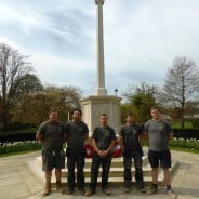 Five males in front of war memorial