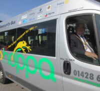 Mayor in driver's seat of a hoppa bus